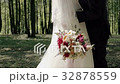beautiful kiss of the bride and groom in the woods 32878559