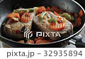 Cutlets for hamburgers are fried in a frying pan 32935894