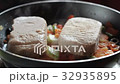 Cutlets for hamburgers are fried in a frying pan 32935895