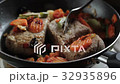 Cutlets for hamburgers are fried in a frying pan 32935896
