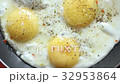 Breakfast just cooked with scrambled eggs in a 32953864