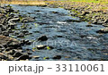 The stream flowing on pebble background with sunny 33110061