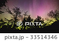 Time lapse of Northern lights dancing across sky 33514346
