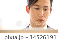 Businessman working on a PC 34526191