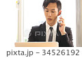 Business man calling while working with PC 34526192