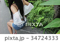 woman suffers from back pain, ache, injury 34724333