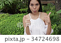woman giving two thumbs up, multiple actions 34724698