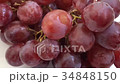 A lot Red Grapes White background wet water 34848150
