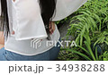 woman suffers from back pain, ache, injury 34938288