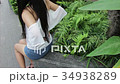 woman suffers from back pain, ache, injury 34938289
