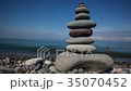 Pyramid  pebbles against the backdrop of mountains 35070452