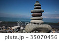 Pyramid  pebbles against the backdrop of mountains 35070456
