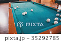 Young guy beats a cue on the ball 35292785