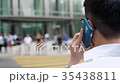 Asian businessman on the phone standing 35438811