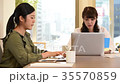 A woman working on a computer 35570859