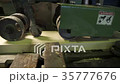Wood being transported in a conveyor belt in a 35777676