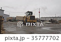 The tractor carries firewood, on the territory of 35777702
