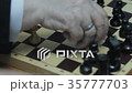 Close up, chess, old hands people are playing in 35777703