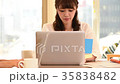 A woman working on a computer 35838482