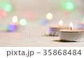 burning candles close-up against a background of 35868484