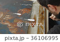 Artist Working in the Studio Restores the Icon 36106995