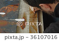 Artist Working in the Studio Restores the Icon 36107016