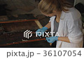 Artist Working in the Studio Restores the Icon 36107054