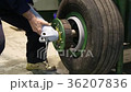 The worker collects the wheel of the aircraft. 36207836