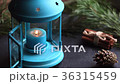 View of festive table with blue lantern and Christ 36315459
