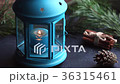 View of festive table with blue lantern and Christ 36315461