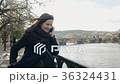 Beautiful Young Woman Tourist In Prague Using Her 36324431