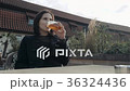 Young Woman Drinking Glass of Beer In a Street 36324436