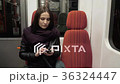 Portrait of a Young Woman Typing Message On Mobile 36324447