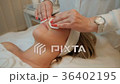 Experienced cosmetologist cotton wool relaxes the Experienced cosmetologist cotton wool relaxes the 36402195