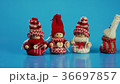 Dancing figures in winter clothes. 36697857