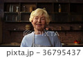 Cheerful woman embracing her elderly mother 36795437