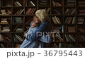 Joyful senior woman and her daughter embracing at 36795443
