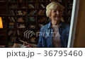 Nice elderly woman drawing at home 36795460