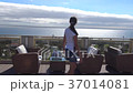The girl walks on the roof of a hotel in Italy and 37014081