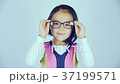 A little Korean girl wears glasses. 37199571