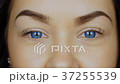 Close-up of a young woman's eyes in blue contact 37255539