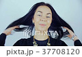 A woman with blue contact lenses. 37708120
