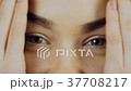 The woman spreads her palms in front of her face 37708217