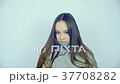Beautiful young woman with lenses in her eyes 37708282