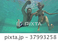 Man and woman dive underwater. 37993258