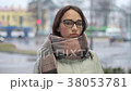 Portrait of a pretty young female looking at 38053781