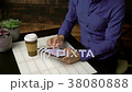 Man using search engine sips coffee 38080888