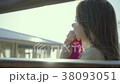 Beautiful charming little girl eats an ice cream 38093051