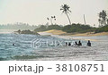 Unknown teen boys swim in the stormy ocean waves 38108751