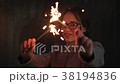 Portrait of a happy teenager holding sparklers  38194836
